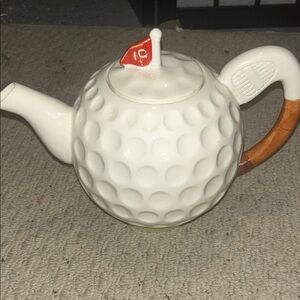 Golf Ball Teapot with  handle that looks like a bent club. 1986 Seymour Mann